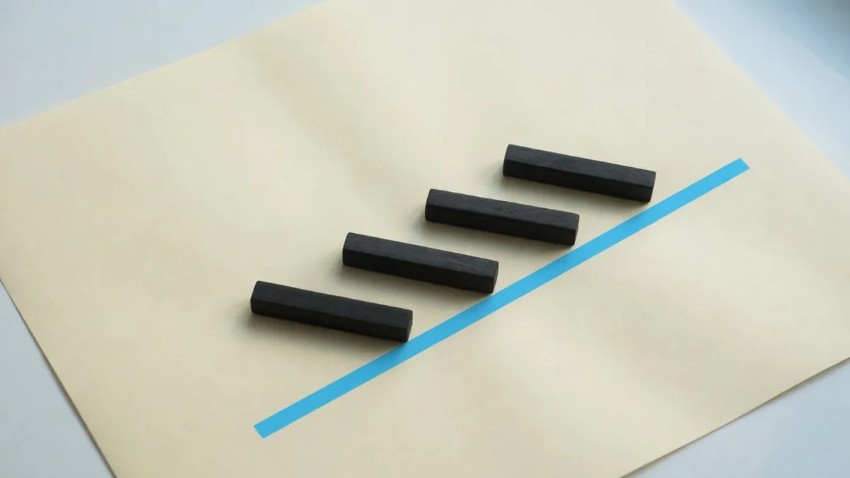 Four charcoal bars step up across warm paper, crossed by one blue line.